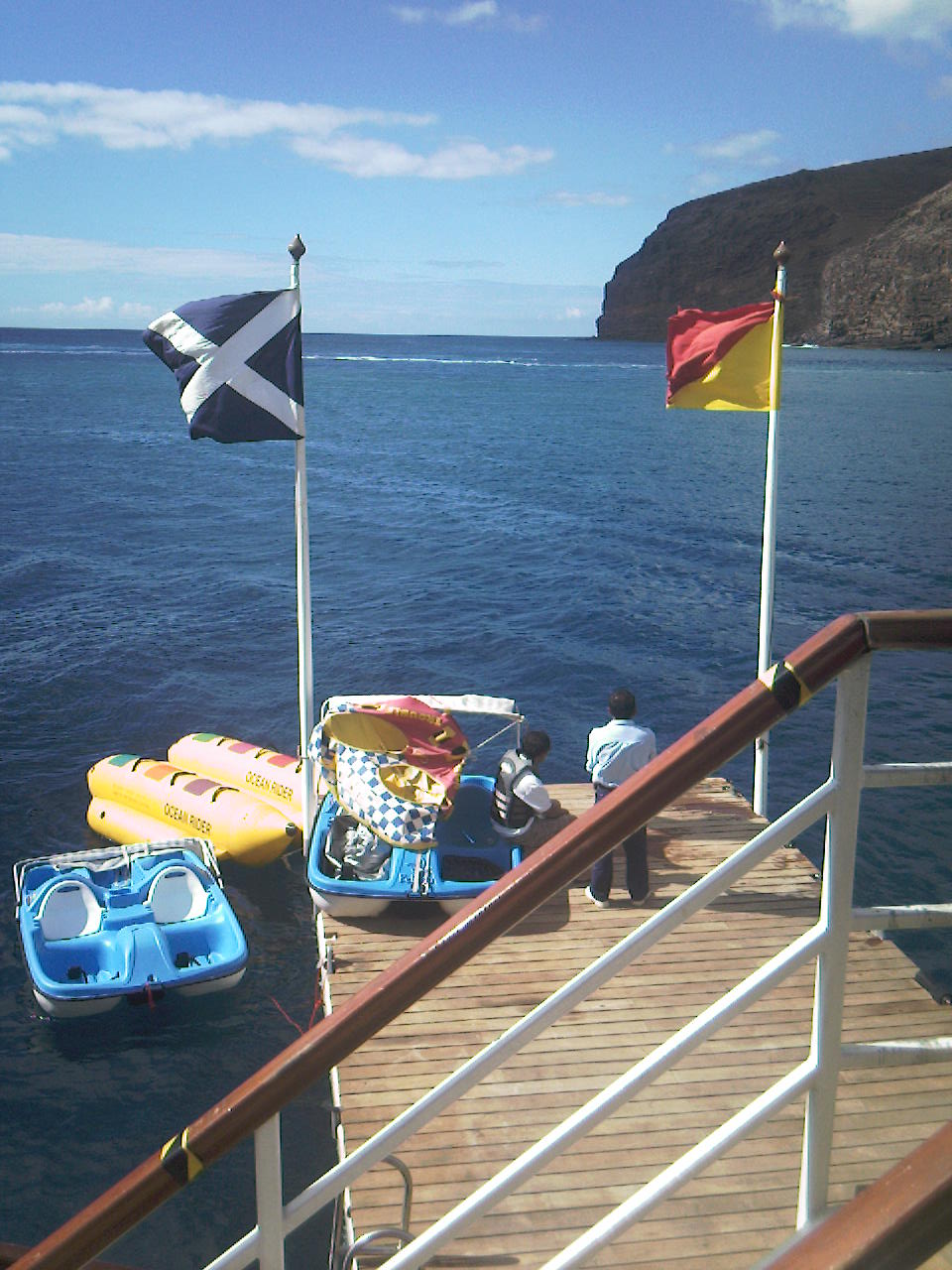 The pedalos and inflatable banana boat alongside the floating water sports deck in San Sebastian de la Gomera