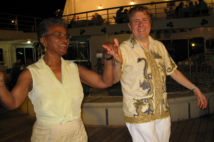 Gertrude & Martin dancing on deck on tropical night